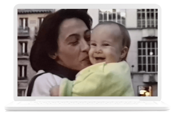 A smiling woman and her baby.