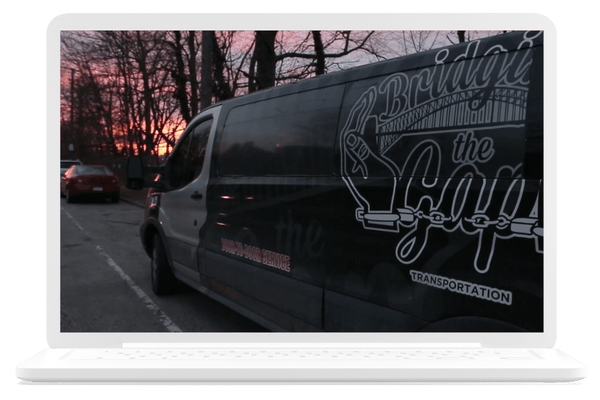 A van with the words "Bridging the Gap" displayed on the side.